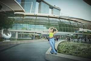 Ananya embraces love against the captivating backdrop of Marina Bay Sands, where architecture and grandeur converge in Singapore's iconic skyline.