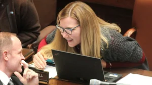 AP : Democratic State Sen. Nicole Mitchell, right, of Woodbury, speaks with Sen. Robert D. Farnsworth, a Republican from Hibbing, on the floor of the Minnesota Senate on April 2, 2024, at the State Capitol in St. Paul, Minn. 