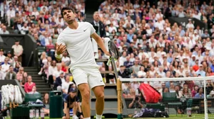 AP Photo/Alberto Pezzali : Carlos Alcaraz of Spain reacts during his fourth-round match against Ugo Humbert of France at the Wimbledon tennis championships in London.