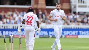 Steven Paston/PA via AP : England's Gus Atkinson, right, after taking the wicket of West Indies' Kavem Hodge on day two of the first Test match between England and West Indies at Lord's Cricket Ground, London.