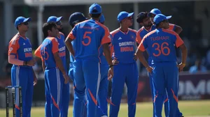 AP Photo/Tsvangirayi Mukwazhi : Indian players wait for the umpire's decision during the T20 cricket match between Zimbabwe and India at the Harare Sports Club, in Harare.