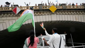 AP : Indian athletes wave from a boat on the Seine River in Paris, France, during the opening ceremony of the 2024 Summer Olympics, Friday, July 26, 2024.