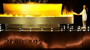 AP/Rebecca Blackwell : The cauldron is lit by torch bearers Marie-Jose Perec and Teddy Riner in Paris, France, during the opening ceremony of the 2024 Summer Olympics, Friday, July 26, 2024.