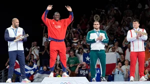 Eugene Hoshiko/AP : Mijain Lopez Nunez celebrates his historic victory in Paris