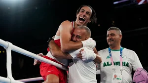 AP/Ariana Cubillos : Algeria's Imane Khelif celebrates after defeating China's Yang Liu to win gold in their women's 66 kg final boxing match at the 2024 Summer Olympics, Friday, Aug. 9, 2024, in Paris, France.