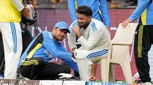 AP Photo/Aijaz Rahi : India's Rishabh Pant reacts in pain as he is attended by a member of support staff after getting hurt during day two of the first cricket test match between India and New Zealand at the M.Chinnaswamy Stadium, in Bengaluru.