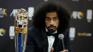 AP : Qatar's Akram Afif speaks during a press conference after receiving the player of the year award of the Asian Football Confederation in Seoul.