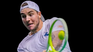 AP/Manu Fernandez : Germany's Jan-Lennard Struff returns the ball against Canada's Denis Shapovalov during their Davis Cup quarter-final match in Malaga.