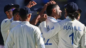 AP/Trevor Collens : Harshit Rana, third right, is congratulated by teammates after taking the wicket of Travis Head on the first day of the first Test between Australia and India in Perth.