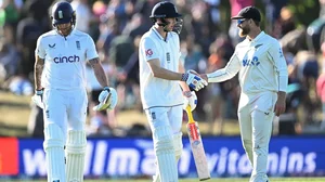 AP/Andrew Cornaga                   : Harry Brook (c) is congratulated by Kane Williamson (R) after scoring a century, as he leaves the field at the close of play with teammate Ben Stokes.