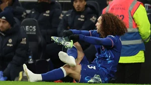 AP/Ian Walton : Chelsea's Marc Cucurella changes his shoes during the English Premier League soccer match between Tottenham Chelsea, at the Hotspur stadium in London, Sunday, Dec.8, 2024.