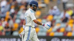 AP : Virat Kohli walks back after being dismissed in the third India vs Australia Test in Brisbane.