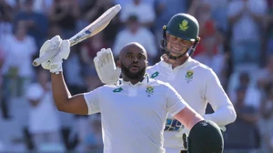 Photo: AP : Temba Bavuma celebrates his century on Day 1 of the second South Africa vs Pakistan Test in Cape Town.