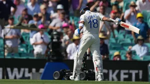 AP Photo/Mark Baker : India's Virat Kohli reacts as he walks from the field after he was dismissed during play on the second day of the fifth cricket test between India and Australia at the Sydney Cricket Ground, in Sydney.