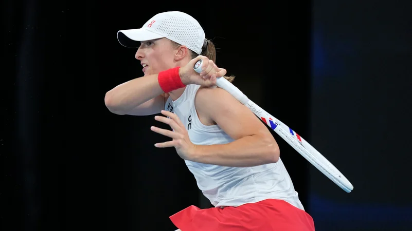 Polands Iga Swiatek hits a forehand to Coco Gauff. AP Photo