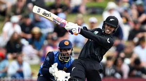 Andrew Cornaga/AP              : New Zealand's Mark Chapman, right, bats in front of Sri Lanka's Kusal Mendis during their one day international cricket match in Hamilton, New Zealand