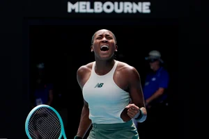 AP Photo/Asanka Brendon Ratnayake : Coco Gauff of the U.S. celebrates after defeating Belinda Bencic of Switzerland in a fourth round match at the Australian Open tennis championship in Melbourne, Australia, Sunday, Jan. 19, 2025.