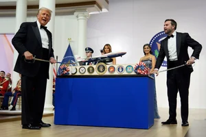 AP : President Donald Trump and Vice President JD Vance hold sabre's before cutting a cake at the Commander in Chief Ball, part of the 60th Presidential Inauguration