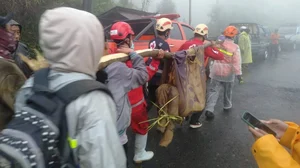 AP : In this photo released by Indonesia's National Disaster Management Agency (BNPB), rescuers carry the body of a victim of flash flood in Pekalongan, Central Java, Indonesia on Tuesday, Jan. 21, 2025.