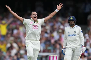 | Photo: AP/Mark Baker : AUS vs IND 5th Test Day1: Australia's Scott Boland reacts after bowling a delivery