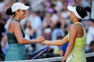 | Photo: AP/Vincent Thian : Australian Open 2025: Madison Keys, left, is congratulated by compatriot Ann Li 