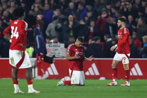 | Photo: AP/Darren Staples : EPL 2024-25: Nottingham Forest's Murillo, center, Ola Aina, left, and Alex Moreno react at the end of the match