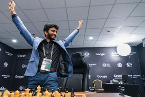 | Photo: FIDE/Eng Chin An via PTI  : World Chess Championship 2024: D Gukesh of India responds to defeating Ding Liren of China