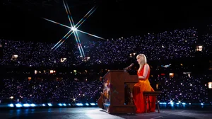 X : Taylor Swift performing during Eras Tour