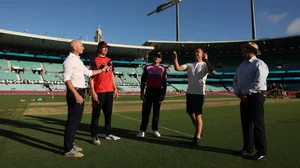 X/BBL : Captains Will Sutherland and Moises Henriques at the toss for the Melbourne Renegades vs Sydney Sixers match in Big Bash League.