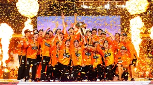 Perth Scorchers’ players rejoice with trophy after winning BBL 2021-22.