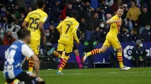 Luuk de Jong (R) celebrates after scoring Barcelona's 2nd goal Vs Espanyol in La Liga on Sunday.