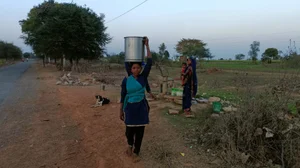 Women walking long distances to procure water in Mirzapur, Uttar Pradesh