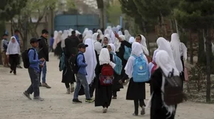 Afghan students leave school classes in a primary school in Kabul, Afghanistan. 