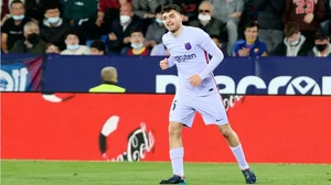 Barcelona's Pedri celebrates after scoring against Levante in a La Liga 2021-22 game.