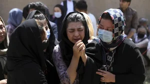 Afghan Hazaras attend the funeral of Mina Khiari, who was killed in a bombing in Kabul in 2021.