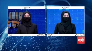 Female Afghan anchors in face coverings 