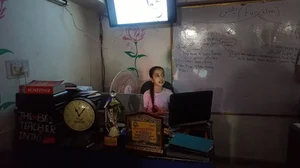 Sana Sultani, 13, gives a presentation in her classroom about the life of the legendary Muhammad Ali