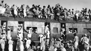 People travelling in a train during the India-Pakistan Partition 