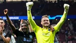 Club Brugge's goalkeeper Simon Mignolet celebrates after their UCL match against Atletico Madrid.