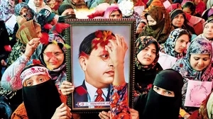 In High Esteem: Muslim women holding a framed photograph of Dr. B.R. Ambedkar during anti-CAA protes