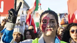 Protesters march in solidarity with protesters in Iran on the National Mall in Washington, DC