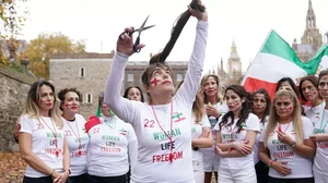 Women in Iran protesting morality laws.