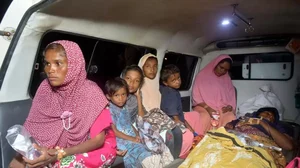 Ethnic Rohingya women and children sit inside an ambulance on Monday, Dec. 26, 2022.