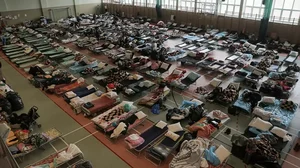 Hundreds of beds are placed inside a sports hall to accommodate Ukrainian refugees fleeing Russian i