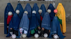 An Afghan women's soccer team poses for a photo in Kabul. Afghanistan's Taliban rulers have banned women from sports as well as from most schooling and many realms of work.