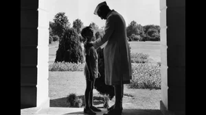 Pandit Nehru, talks to his grandson Rajiv Gandhi.