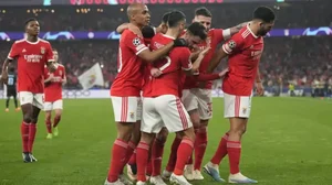 Benfica's players celebrate after scoring their side's opening goal during the UCL game vs Brugge.