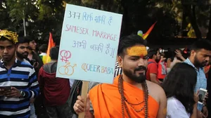 A Hindu supporter joins the Delhi Queer Pride parade in New Delhi, India.