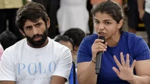 Wrestlers Sakshee Malikkh (R) and Bajrang Punia