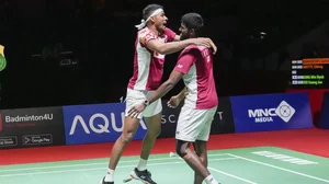 Chirag, left, and Satwik celebrate their doubles win on Saturday.